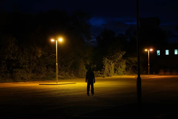 Mysterious Hooded Figure Standing Back Camera Street Lights Night — Stock Photo, Image