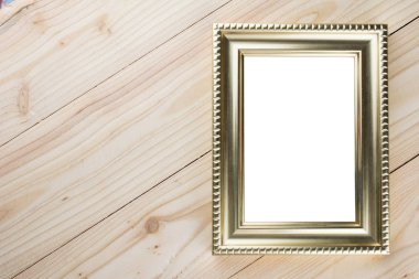 Ahşap üzerinde altın fotoğraf çerçevesi