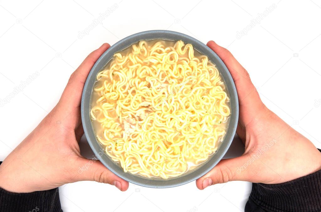Instant Noodles served in gray plate on white background.