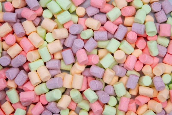 Mini marshmallows coloridos macro. Textura e padrão de marshmallows fofos. Imagem de alta resolução . — Fotografia de Stock