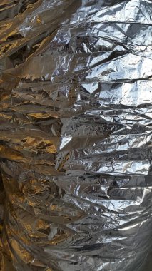 Folyo. Buruşuk folyo. Buruşuk folyonun arka planı. Yaratıcı arka plan