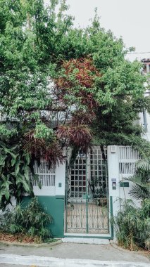SAO PAULO, BRAZIL - CIRCA SEPTEMBER 2019: hilly landscape and sloping streets in bohemian Vila Madalena neighborhood with a lot of street art in Sao Paulo on a sunny summer day.