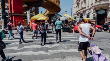 SAO PAULO, BRAZIL - CIRCA SEPTEMBER 2019: busy streets and tall buildings in downtown of Sao Paulo on a hot sunny day.