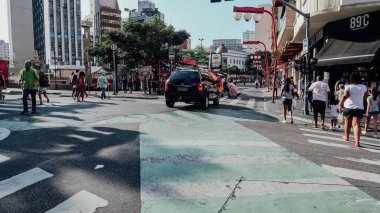 SAO PAULO, BRAZIL - CIRCA SEPTEMBER 2019: streets and buildings with many ships in Japantown neighborhood in central Sao Paulo on a sunny day.