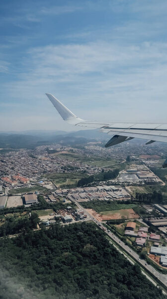 SAO PAULO, BRAZIL - CIRCA SEPTEMBER 2019: aerial view of Sao Paulo from airplane window on a sunny day.