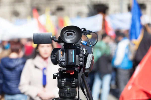 Filming street protest using a video camera — Stock Photo, Image