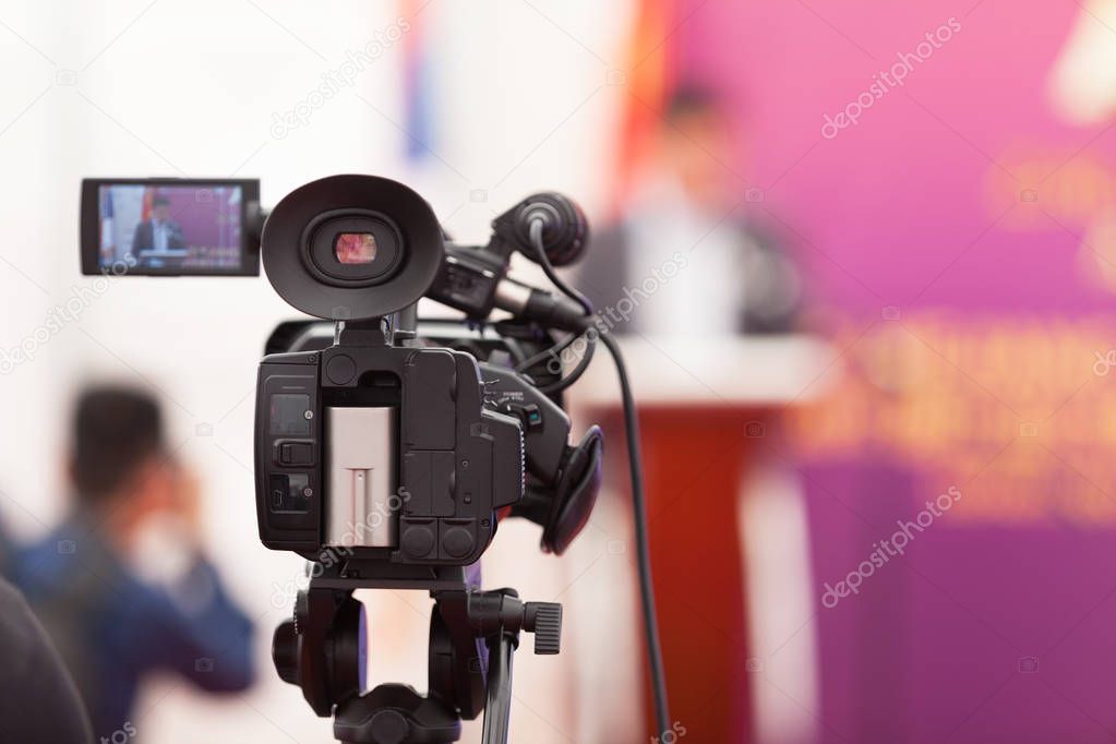 Filming an media event with a video camera