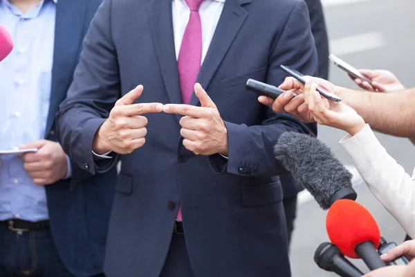 Media interview. Hand gesture. — Stock Photo, Image