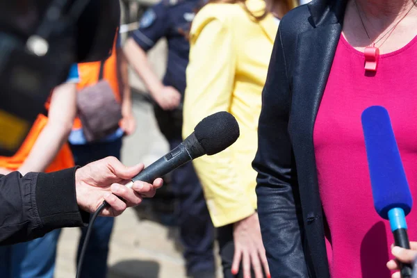 Reporters holding microphones — Stock Photo, Image