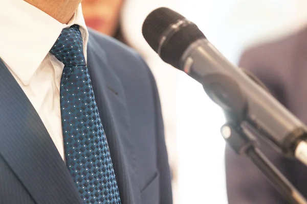 Business person or politician is giving a speech at news conference — Stock Photo, Image