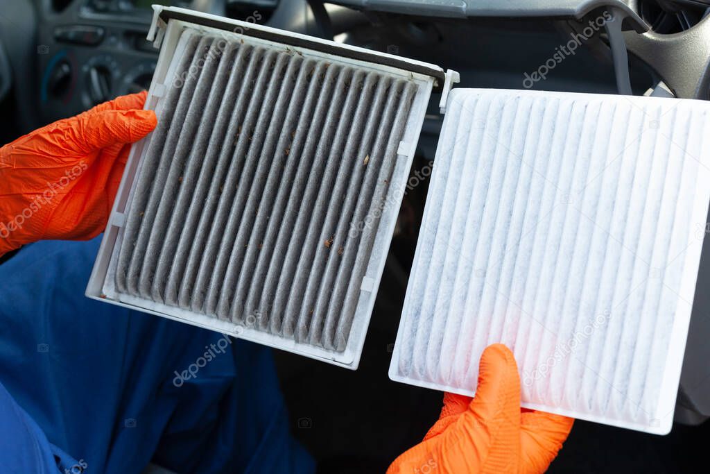 Old and new cabin pollen air filter for a car