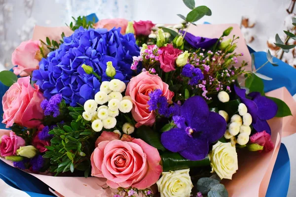 Bouquet of flowers on  table. beautiful blooming bouquet of colorful flowers on window.