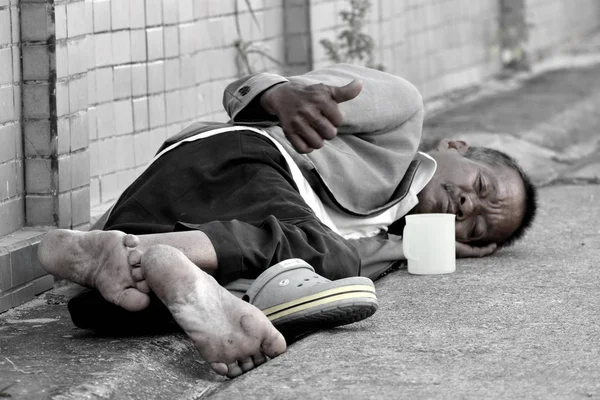 Monochrome photo. Asian male Beggar asking for money autdoor — Stock Photo, Image