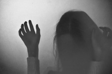 The Ghost of a child. a game of shadows. Kids scary Ghost silhouette.