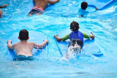 people in Askapache. Fun in the water. The entertainment artificial waves