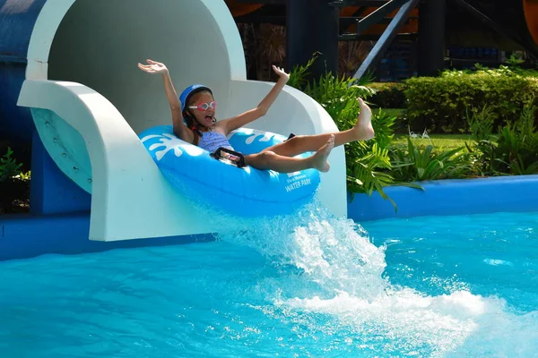 The water rides in the tropics. Girl swims in the water Park. — 스톡 사진