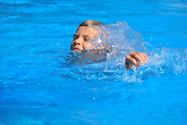 Child boy swimmer. The boy in the pool at the hotel. Sports holiday with children at the resort. — 스톡 사진