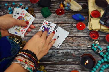 Female fortune teller with Tarot cards. Magic and esoteric background. ESP.