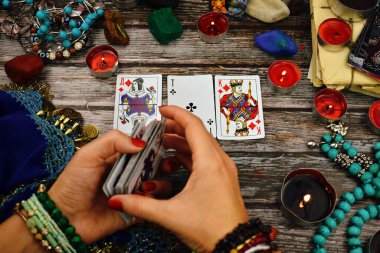 Female fortune teller with Tarot cards. Magic and esoteric background. ESP.
