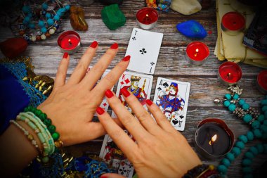 Female fortune teller with Tarot cards. Magic and esoteric background. ESP.