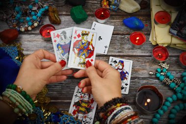 Female fortune teller with Tarot cards. Magic and esoteric background. ESP.