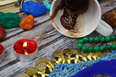 Coffee grounds in the Cup divination. Prediction of fate. Mysticism and mystery. Fortune teller is a fraud.