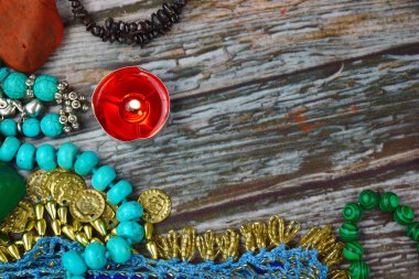 The occult and esoteric background. Candles, stones and beads on the table. Magic and magic