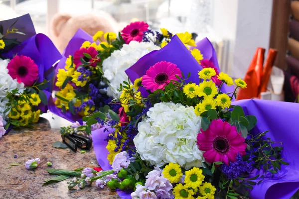 Beautiful flowers on the table. Flower salon. Women\'s day