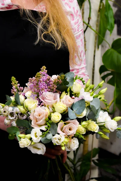 Desk florist in flower shop. The order and delivery of flowers home. small floral business.