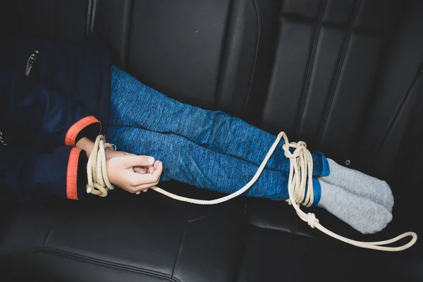 Kidnapped boy in the car. Related children's hands. stealing people — Stock Photo, Image