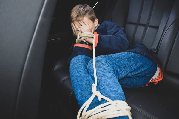 The captive child in the car. Illegal theft and ransom of a child — Stock Photo, Image