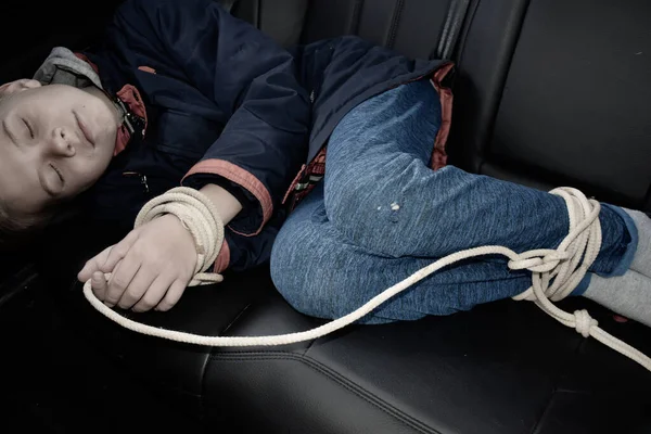 The captive child in the car. Illegal theft and ransom of a child — Stock Photo, Image