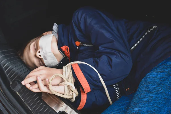 The captive child in the car. Illegal theft and ransom of a child — Stock Photo, Image