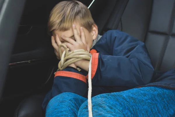 The captive child in the car. Illegal theft and ransom of a child — Stock Photo, Image