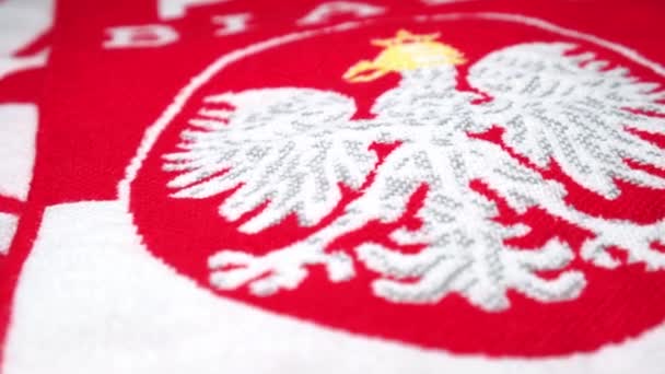 Closeup of red - white fan - scarf with the Eagle - national emblem of Poland. — Stock Video