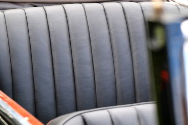 Black leather trim for luxury car seats closeup