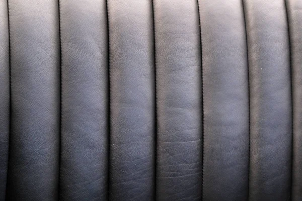 Black leather trim for luxury car seats closeup