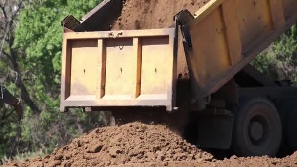 Dump Truck Unload Soil Ground Highway Construction Heavy Industrial Machines — Stock Video