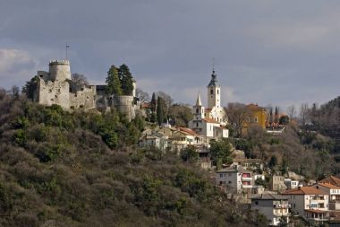 Fort on the hill above town clipart