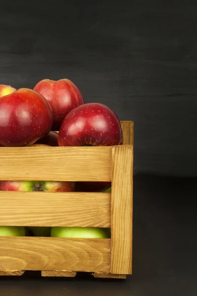 Fresh red autumn apples in farmhouse style wooden crate. Sales of farm products. Advertising for the sale of fruit. — Stock Photo, Image