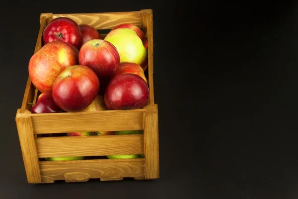Fresh red autumn apples in farmhouse style wooden crate. Sales of farm products. Advertising for the sale of fruit. — Stock Photo, Image
