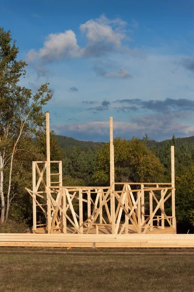 Construction of a wooden house in the woods. Construction of the house. Ecological construction. Construction of family house.