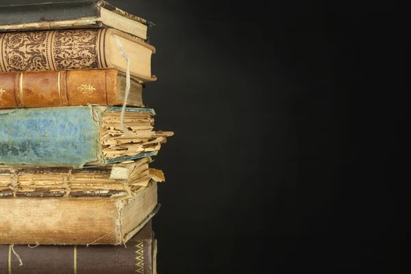 Stack of old books, copyspace for your text. Antique books on old wooden shelf. — Stock Photo, Image