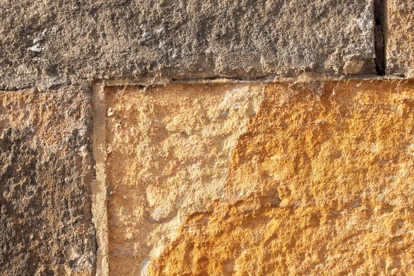 Muralla histórica de arenisca. Detalles de textura de piedra de arena — Foto de Stock