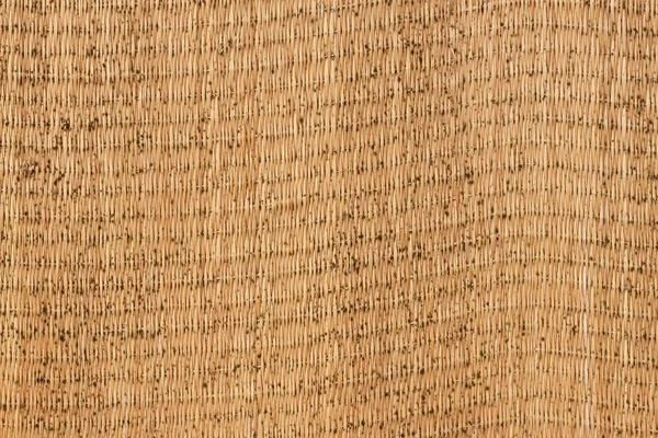 Geschlossen hölzerne Webtextur Hintergrund. verschimmelte Strohmatte. Textur der japanischen Tatami-Matte. — Stockfoto
