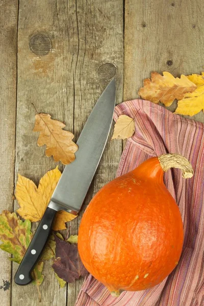 Ripe pumpkins Hokkaido. Autumn vegetables on the kitchen table. Advertising for sale. Preparing traditional pumpkin soup.