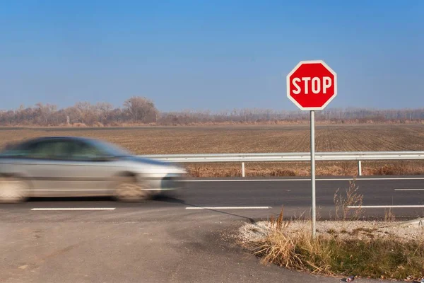 Stop Sign at Crossroads. Roads in the Slovak countryside. Exit onto the main road. Main road. Dangerous road. Traffic signs stop. — Stock Photo, Image