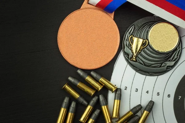 Shooting competition. Award winners. Biathlon victory. Ammunition and winners medals in biathlon. Diploma of shooting competitions. Background diploma.