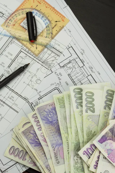 Money to build a house. Mortgage installment. Valid Czech banknotes. Part of architectural project, architectural plan, technical project, construction plan. — Stock Photo, Image