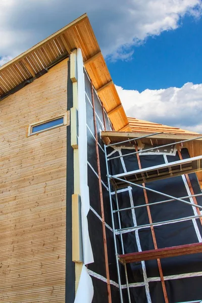 Polystyrene insulation of wood buildings. Eco-friendly building insulation.
